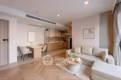 Modern open-plan living room with stylish kitchen and cozy seating area