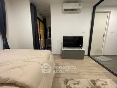 Modern bedroom with cozy decor and air conditioning in a stylish apartment.