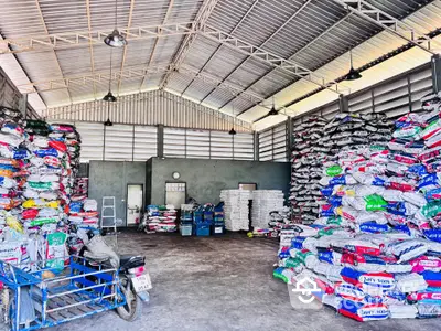 Spacious warehouse interior with high ceilings and organized storage