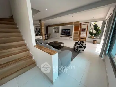 Spacious modern living room with stylish decor and natural light