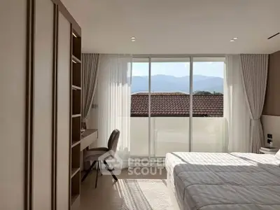 Bright bedroom with mountain view and modern furnishings
