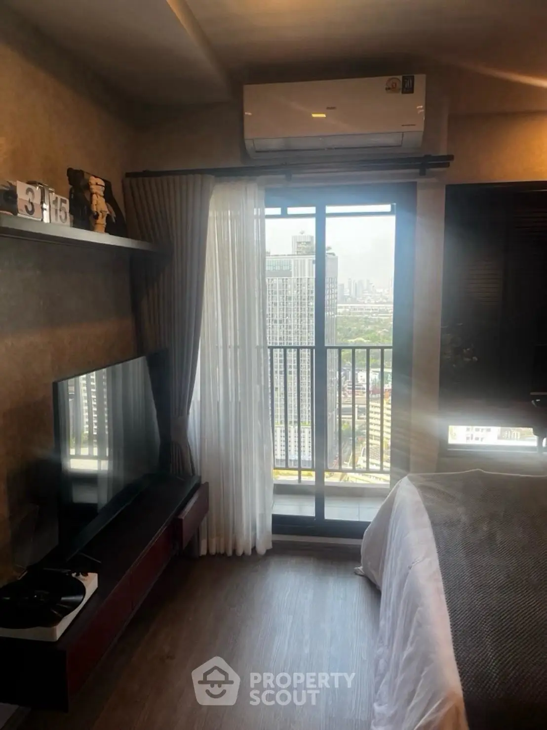 Modern bedroom with city view and sleek decor