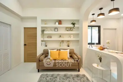 Modern living room with cozy sofa and stylish open kitchen layout