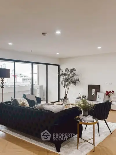 Spacious modern living room with elegant decor and large windows