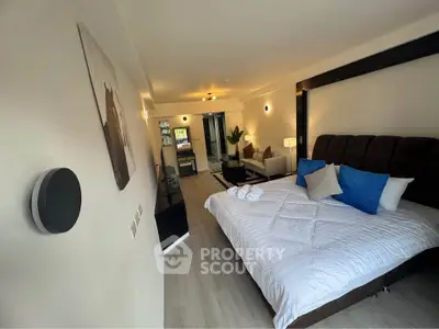 Spacious bedroom with modern decor and cozy ambiance