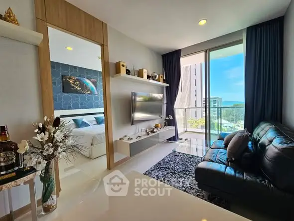 Modern living room with sleek design and balcony view, featuring stylish decor and natural light.