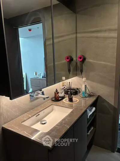 Luxurious modern bathroom with marble countertop and stylish fixtures