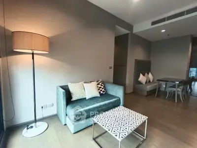 Modern living room with stylish sofa and chic decor in a contemporary apartment.