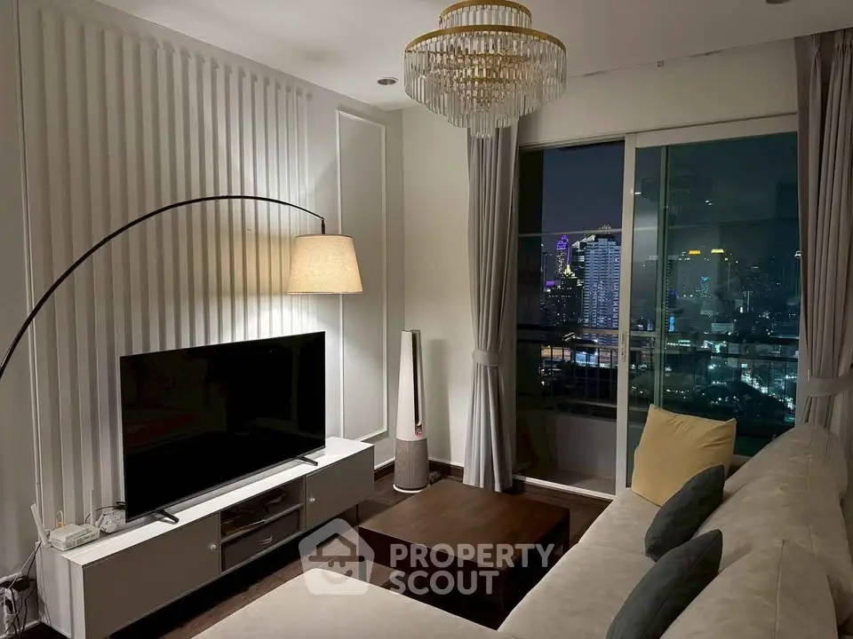 Elegant living room with city view, modern decor, and cozy ambiance.