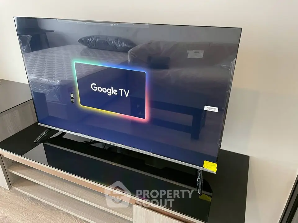 Modern living room with sleek Google TV on stylish stand, perfect for entertainment enthusiasts.