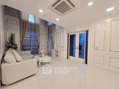 Elegant living room with high ceilings and luxurious decor