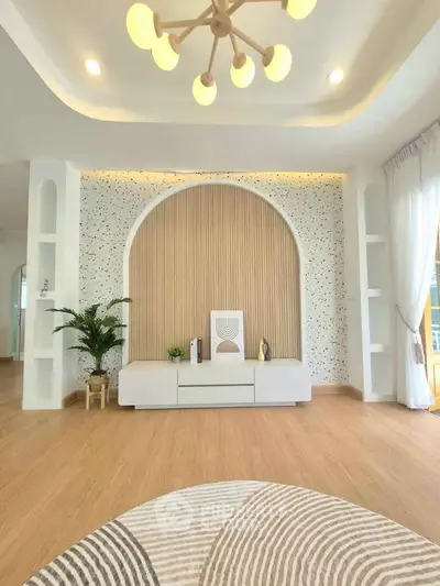 Modern living room with stylish decor, featuring a unique arch design and elegant lighting.
