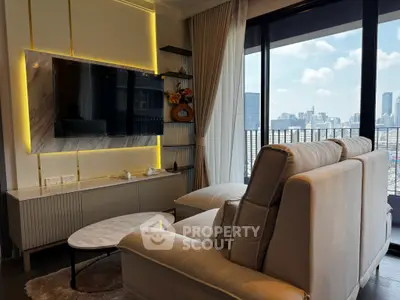 Luxurious living room with modern decor and stunning city view from large windows.