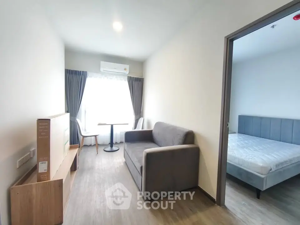 Modern apartment interior with cozy living room and bedroom, featuring stylish furniture and natural light.