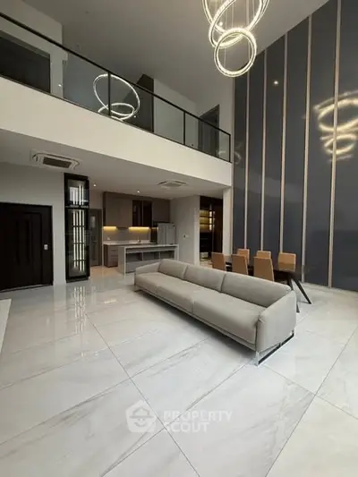 Luxurious modern living room with high ceilings and elegant lighting
