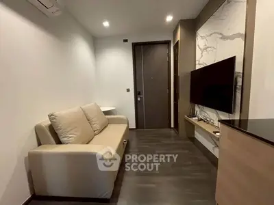 Modern living room with sleek design and wall-mounted TV