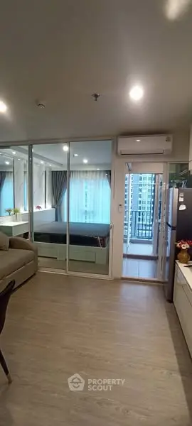 Modern apartment interior with open layout and balcony view