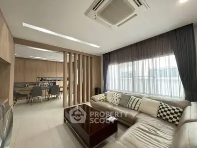 Spacious modern living room with elegant decor and ample natural light