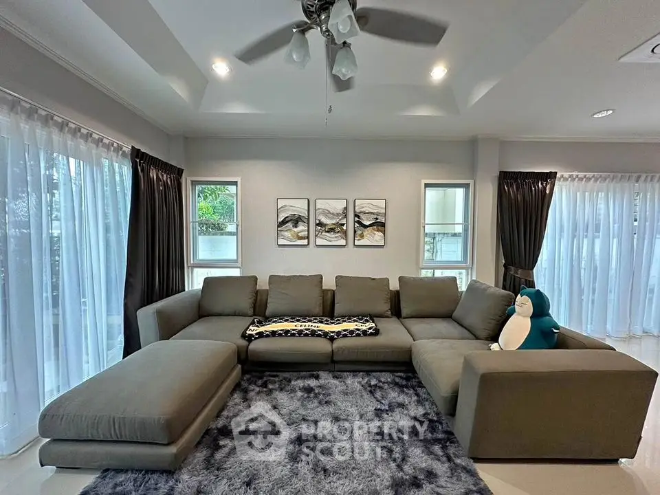 Spacious living room with plush sectional sofa and modern decor