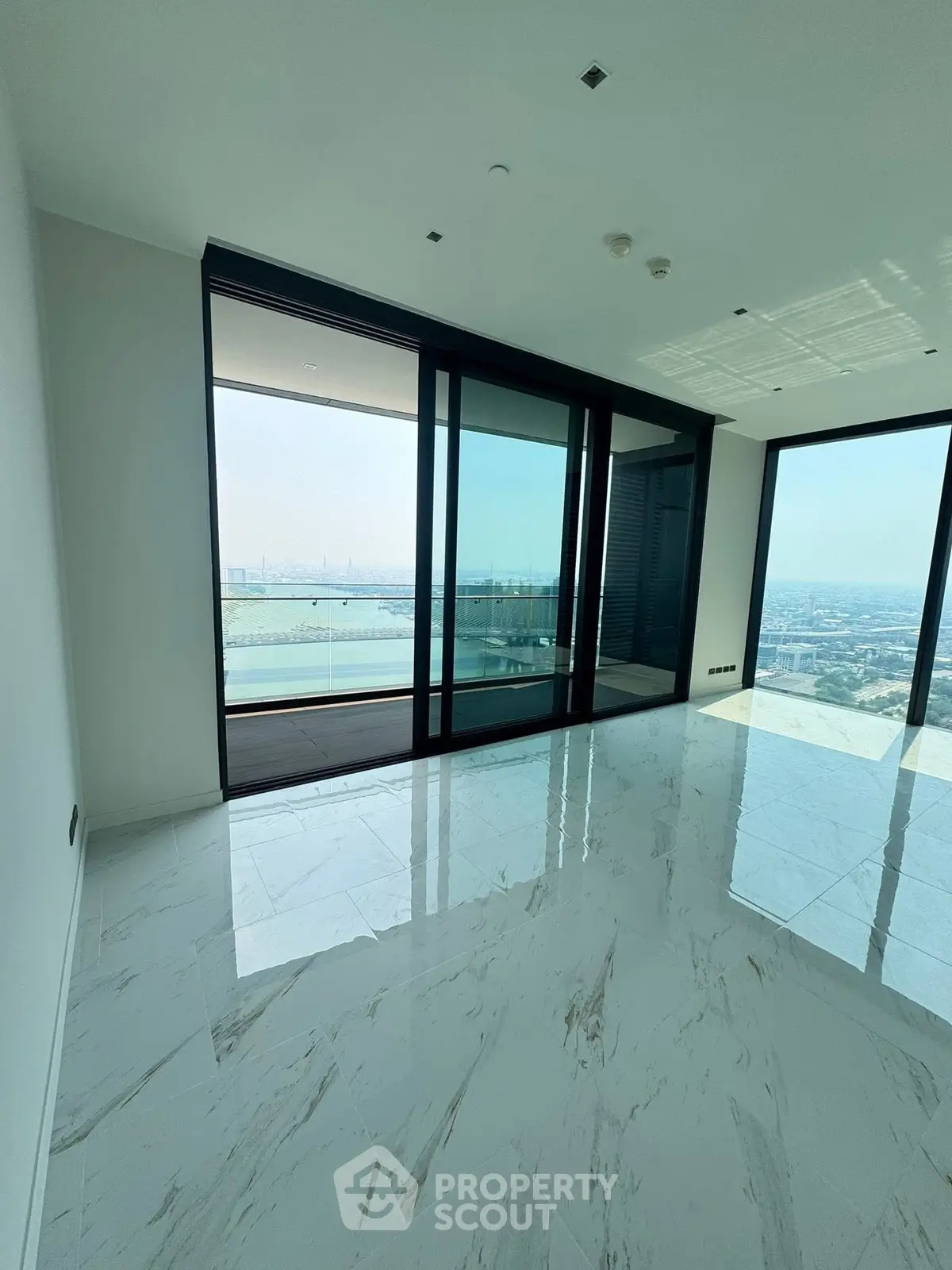 Luxurious corner unit with stunning panoramic views and spacious balcony, featuring sleek modern design and floor-to-ceiling windows.