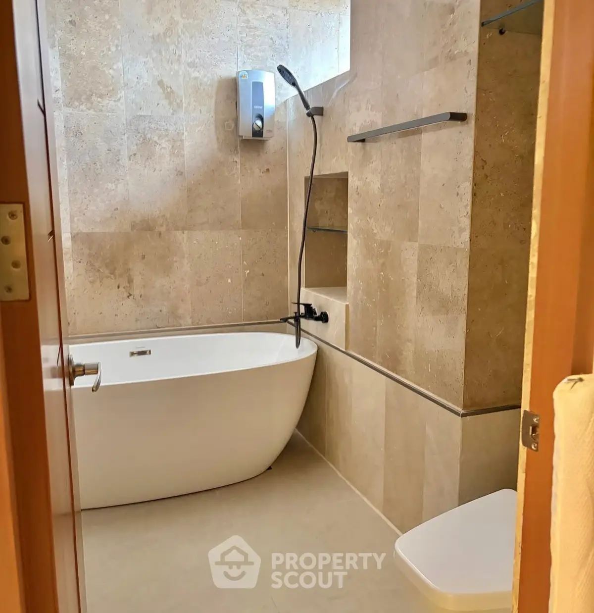 Luxurious bathroom with modern bathtub and elegant stone tiles