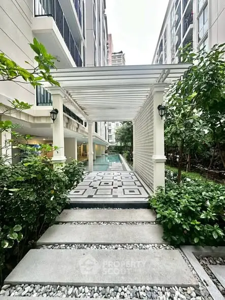 Elegant apartment entrance with lush greenery and modern design