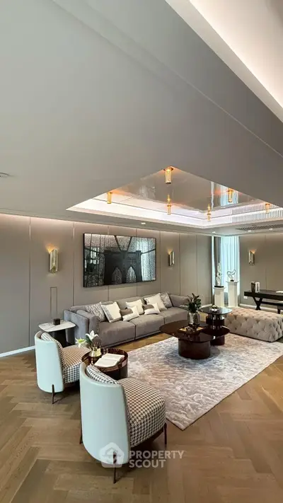 Luxurious modern living room with elegant decor and spacious seating area.