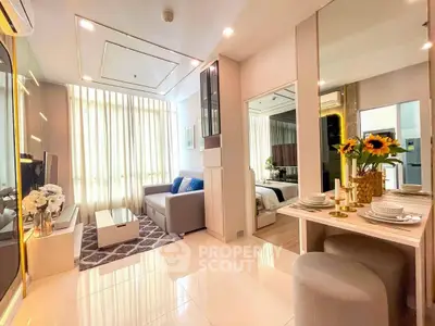 Modern living room with elegant decor and open layout, featuring cozy seating and dining area.