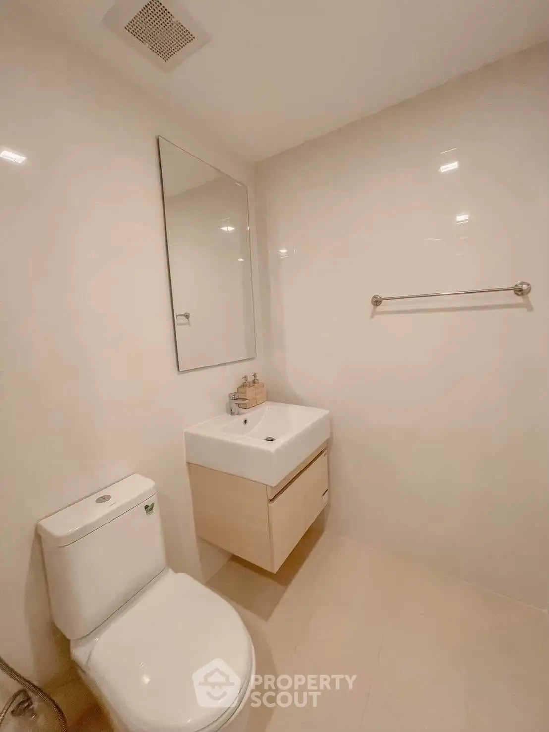 Modern minimalist bathroom with sleek fixtures and neutral tones