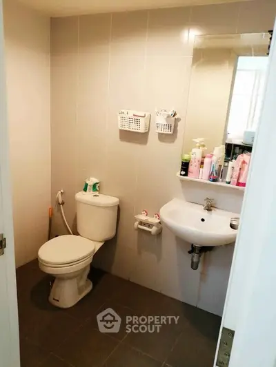 Modern bathroom with sleek fixtures and ample storage space.