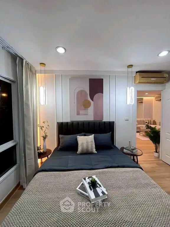 Modern bedroom with stylish decor and cozy ambiance, featuring elegant lighting and a comfortable bed.