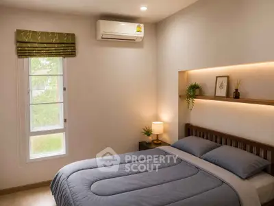 Cozy bedroom with modern decor and natural light, featuring a comfortable bed and air conditioning.