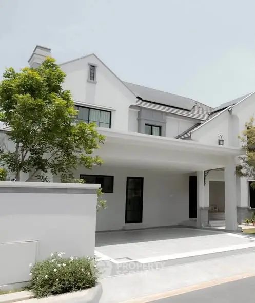 Elegant modern house exterior with sleek design and lush greenery, perfect for contemporary living.