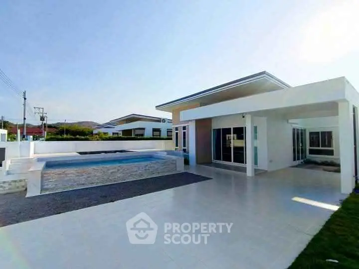 Modern single-story home with sleek design and private pool, perfect for luxury living.