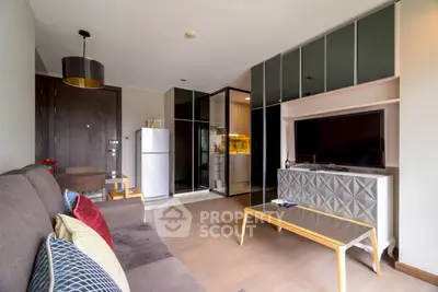 Modern living room with sleek furniture and open kitchen layout
