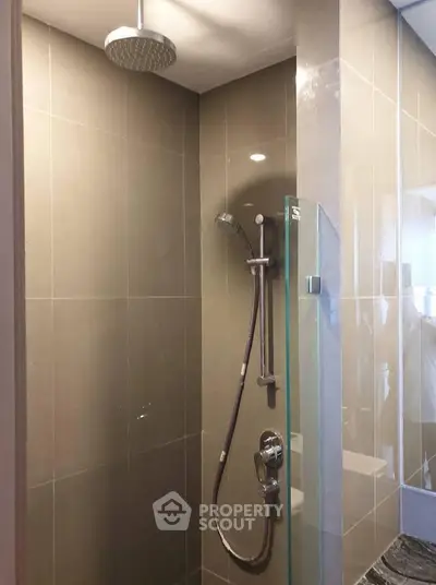 Modern bathroom with sleek shower design and glass partition