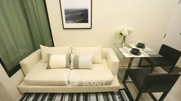 Cozy living room with modern sofa and dining area, perfect for urban living.