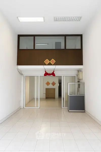 Spacious interior with high ceiling and modern design, ideal for versatile use.