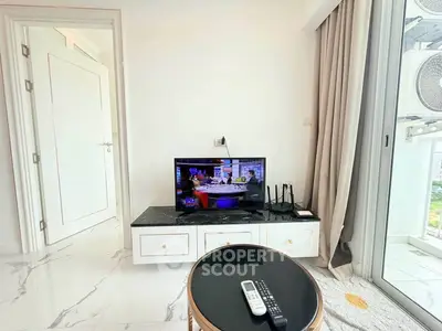 Modern living room with TV and balcony access in stylish apartment