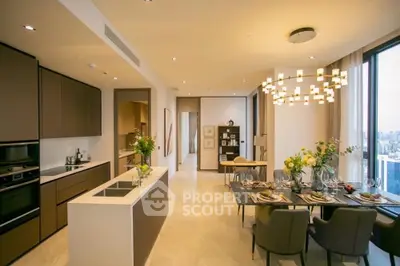 Luxurious open-plan kitchen and dining area with city view