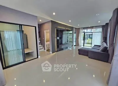 Spacious modern living room with large windows and sleek design