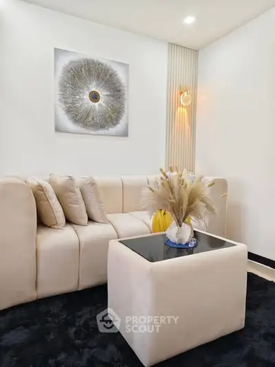 Stylish modern living room with plush beige sofa and elegant decor