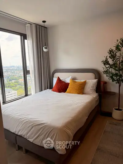 Cozy bedroom with city view and stylish decor