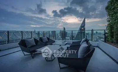 Stunning rooftop terrace with panoramic city views and modern outdoor seating.