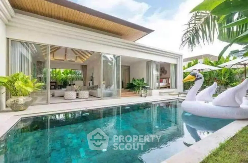 Luxurious villa with private pool and modern open living area, perfect for tropical retreats.