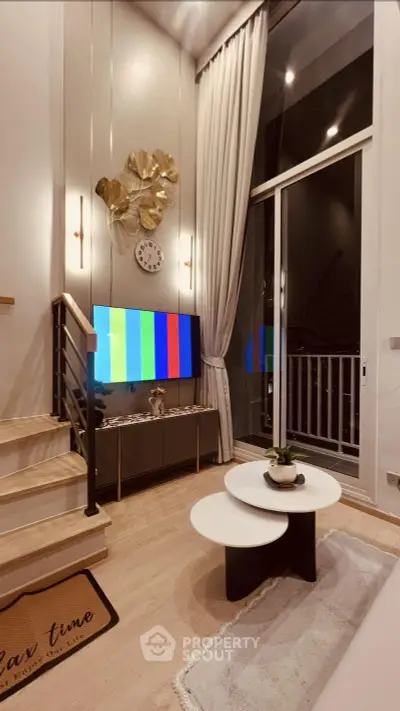 Modern living room with high ceilings, stylish decor, and large windows for natural light.