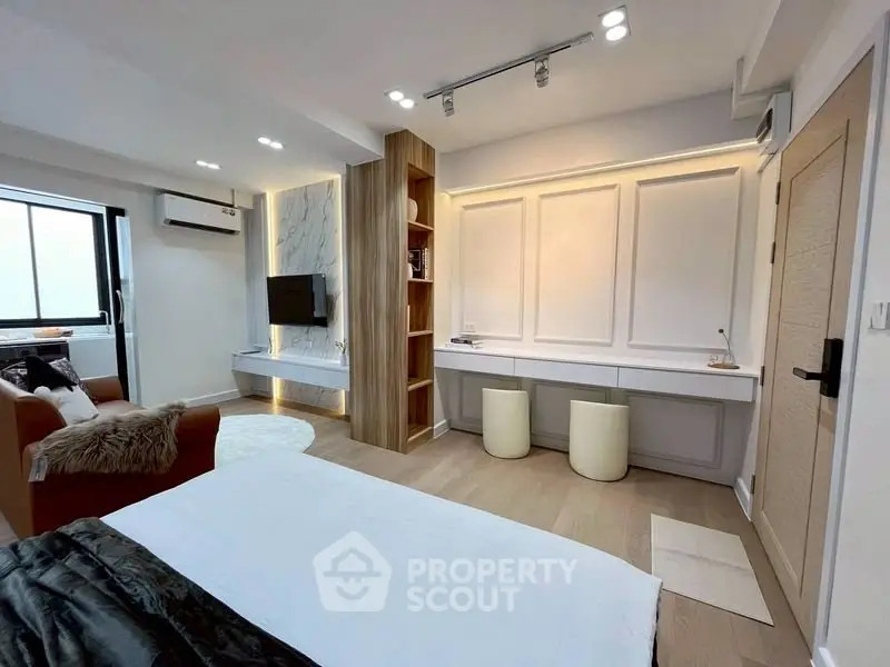 Modern bedroom with stylish decor and built-in storage solutions