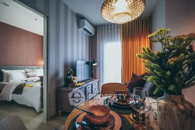 Stylish modern living room with dining area and bedroom view