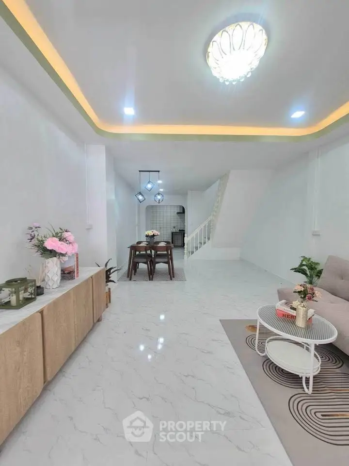 Spacious modern living room with elegant decor and open layout, perfect for family gatherings.
