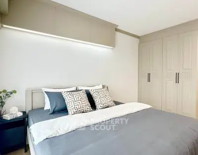 Elegant bedroom with modern decor and ample storage space